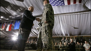 Vice President Dick Cheney participates in a rally with troops at Camp Speicher 