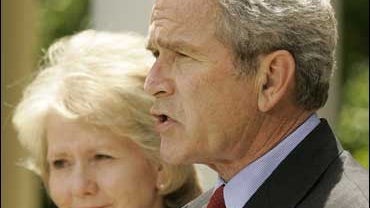 President Bush, right, accompanied by Transportation Secretary Mary Peters, Monday, May 14, 2007, in the Rose Garden of the White House. 