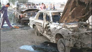 bombed cars after an attack by U.S. warplanes and helicopter, Sadr City 
