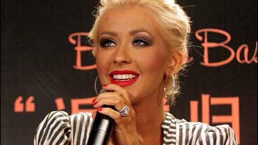 American singer Christina Aguilera speaks during the news conference Monday June 25, 2007 in Shanghai, China. Aguilera, a four-time Grammy Award winner, will perform June 26 at the Grand Stage , which is her first-ever concert in China. 