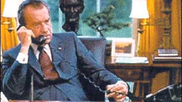 President Nixon at his desk in the Oval Office 