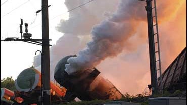 Cars of a freight train, which was traveling from Kazakhstan to Poland and derailed Monday evening, continue to burn near Lviv on the Polish border, Tuesday, July 17, 2007. 
