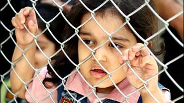 an Iraqi child in a refugee registration center, Doma, Syria 