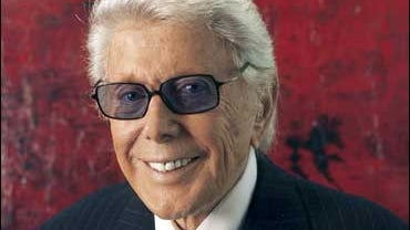 Marvin Zindler poses for a photo Feb. 9, 2006, in Houston. Zindler, the flamboyant TV consumer reporter in Houston whose crusade against a rural brothel inspired "The Best Little Whorehouse in Texas," has died after a battle with pancreatic cancer, televi 