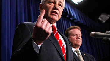 Sen. Chuck Hagel (R-NE) answers reporters' questions while holding a news conference with Sen. Jim Webb 