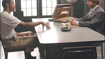 Denzel Washington and Russell Growe in "American Gangster" 