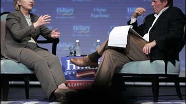 Democratic Presidential hopeful U.S. Sen. Hillary Rodham Clinton, left, D-N.Y., gestures as she talks with author John Grisham during a fundraiser in Charlottesville, Va., Sunday, Sept. 23, 2007. 