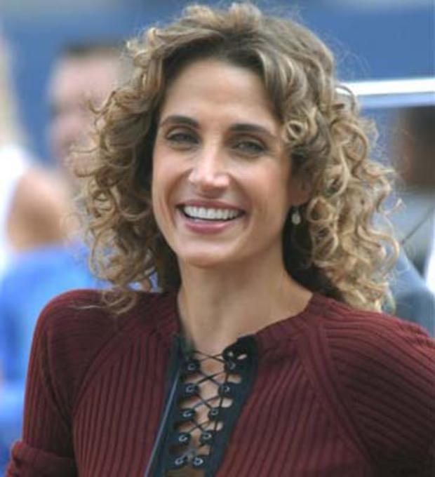 Actress Melina Kanakaredes. of the CBS television series "CSI:NY," stops while filming a 2007  episode in Foley Square,  in New York. (AP Photo/Edouard H.R. Gluck) 