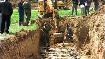 Remains of victims are exhumed from a mass grave in Ovcara, near Vukovar 