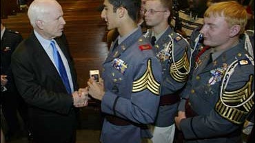 Republican presidential candidate John McCain, shakes hands with Cadet Captain Chris Issac as Cadet Lts.Charles Kennedy, middle, and Andre Peterson, right wait their turn. McCain spoke on Wednesday Oct. 3, 2007 