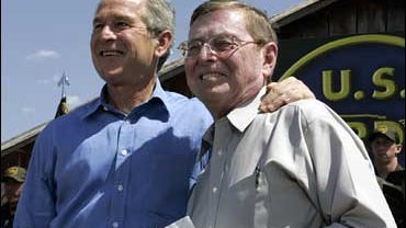 President Bush stands with Sen. Pete Domenici, R-N.M. 