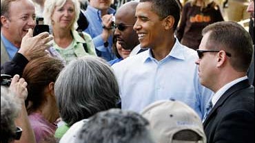 Democratic presidential hopeful, U.S. Sen Barack Obama, D-Il., mingles in with a crowd during a visit to Mack's Apples while campaigning in Londonderry, N.H., Tuesday, Oct. 9, 2007. 