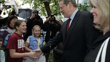 Former Vice President Al Gore shakes hands with Palo Alto school children as his wife Tipper looks on, right, after a news conference in Palo Alto, Calif., Friday, Oct. 12, 2007. Gore won the 2007 Nobel Peace Prize for his efforts in the fight against glo 