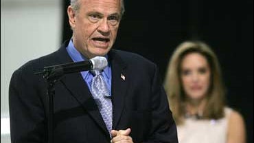 Republican presidential hopeful Fred Thompson is flanked by his wife Jeri as he speaks after arriving in Kennesaw, Ga, Thursday, Oct.18, 2007. (AP Photo/John Bazemore) 