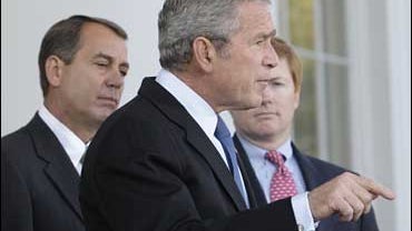 President Bush, center, makes comments on the North Portico of the White House, Tuesday, Oct. 30, 2007. 