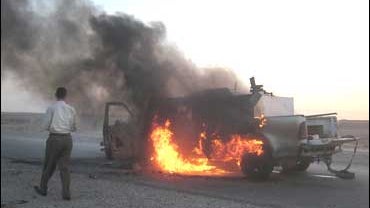 a private security company vehicle hit by a roadside bomb near Beiji, Iraq 