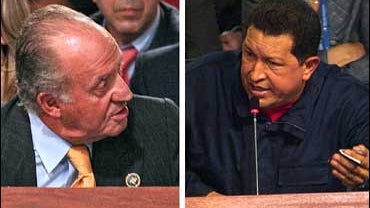 Spanish King Juan Carlos gestures towards Venezuela's President Hugo Chavez 