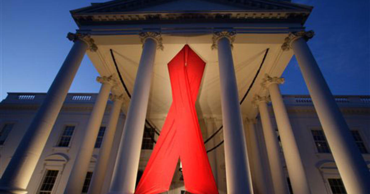 White House hangs red ribbon for World AIDS Day - CBS News