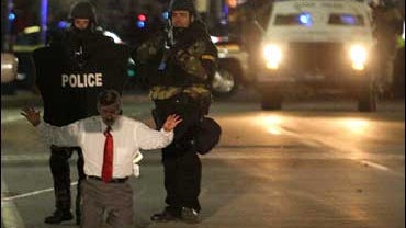 SWAT team members take Leeland Eisenberg into custody 