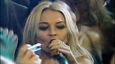 Lindsay Lohan drinks champagne on New Years Eve in Capri 