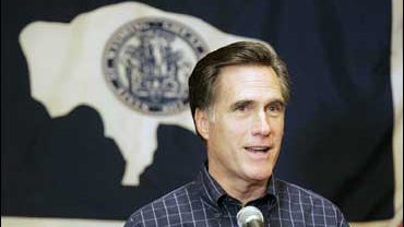 Mitt Romney in front of a Wyoming state flag in Cheyenne 