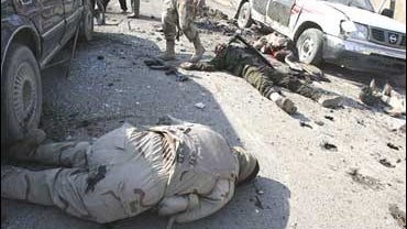 Iraqi Army soldiers moments after a suicide attack on a celebration marking Iraqi Army day, Karradah, Baghdad 