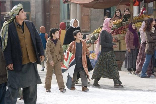 This undated photo released by Paramount shows Zekiria Ebrahimi, center left, and Ahmad Khan Mahmoodzada, center right, in a scene from "The Kite Runner." During this tumultuous awards season at least a dozen movies with literary roots have real shots at  