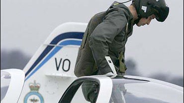 Britain's Prince William climbs out of his aircraft 