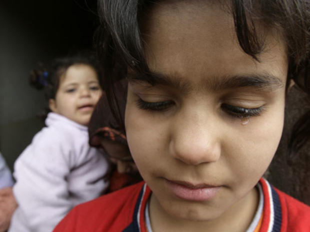 Huda, a daughter of Sheik Abu Rasoul Al-Fariji cries at her family home in northeastern Baghdad, Iraq, Monday, Feb. 11, 2008. 