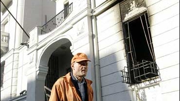 A municipal employee clears the entrance of U.S. embassy in Belgrade, Serbia 