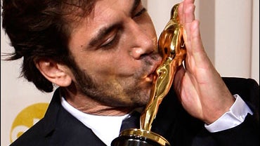 Spanish actor Javier Bardem poses with the Oscar for best supporting actor 