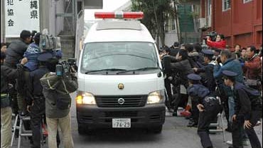 A police car carrying Tyrone Hadnott, a 38-year-old staff sergeant at the U.S. Marine Corps' Camp Courtney, leaves the Okinawa Police Station 