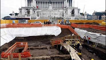 Archaeologists work in an archaeological dig in Rome's central Piazza Venezia Square 
