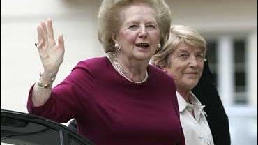 Former British Prime Minister, Margaret Thatcher waves as she returned home from the hospital 