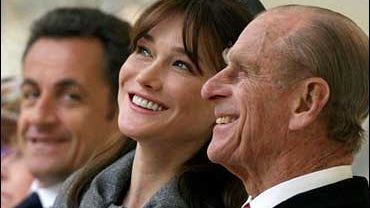 Carla Bruni-Sarkozy, center, and Prince Philip, right, share a joke as she and her husband French President Nicolas Sarkosy, left, watch the ceremonial welcome at Windsor Castle, Windsor, England, Wednesday, March 26, 2008. 