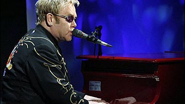 Singer Elton John performs at The Billie Awards 