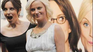 Actors Tina Fey, left, and Amy Poehler attend the opening night of the Tribeca Film Festival with the world premiere of their comedy "Baby Mama" at the Ziegfeld Theater, Wednesday, April 23, 2008, in New York. 