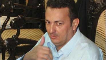 Vitalmiro Moura, center, sits after his trial in Belem, Para state, Brazil 