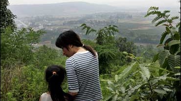 Flood-evacuees look at lower ground 