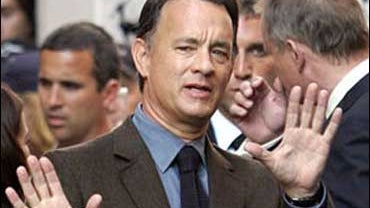 U.S. actor Tom Hanks gestures during the shooting of the movie "Angels and Demons" in downtown Rome, Monday, June 9, 2008. 