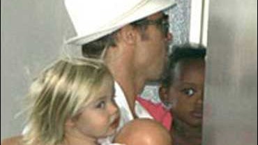 U.S. actor Brad Pitt arrives at the Lenval Hospital in Nice, southern France, carrying his children Zahara, right, and Shiloh, Wednesday, July 2, 2008. U.S. actress Angelina Jolie checked into the Lenval Hospital in the south of France on last Tuesday, wh 