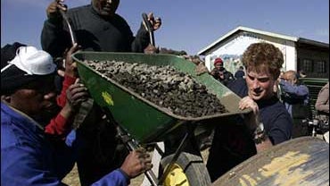 Britain's Prince Harry, right, helps out with the rebuilding of a school for disabled children in Batha-Bathe near Maseru, Lesotho, Tuesday, July 8, 2008, which Harry and a group of 26 soldiers from the Household Cavalry Regiment are helping to rebuild. T 