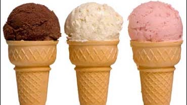 Chocolate, vanilla and strawberry ice cream cones 