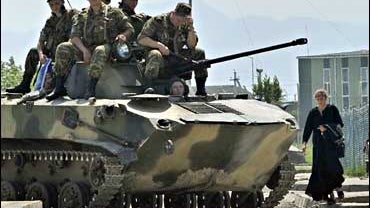 A Russian military vehicle maneuvers at the gate of a Georgian army base that was controlled by Russian forces in Senaki, western Georgia 