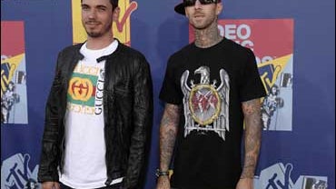 DJ AM, left, and musician Travis Barker pose backstage at the 2008 MTV Video Music Awards 