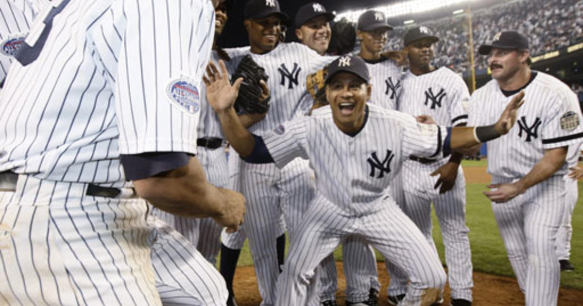 New York Yankees catcher Jorge Posada, left, walks off the field with  former Yankees catcher Yogi Berra after ceremonies at Yankee Stadium in New  York on Sunday, Sept. 21, 2008. The Yankees