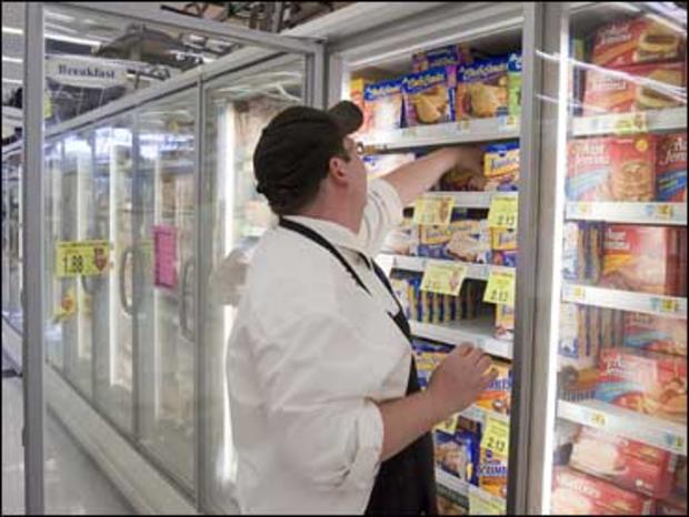 HyVee employee Kevin Kruger stocks the freezers, in Omaha, Neb. on Aug. 28, 2008. Zapping frozen meals in the microwave may be fast and easy, but it also can make you sick if not done properly. 