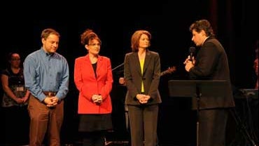 This photo from the Web site of The Office of the Governor of Alaska, shows, from left, Alaska Lt. Gov. Sean Parnell, Gov. Sarah Palin, and Sen. Lisa Murkowski, R-Alaska, being prayed over by Pastor Ed Kalnins and a congregation made up of nearly 20 diffe 