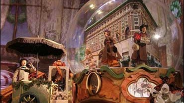 Lord & Taylor's 2008 holiday windows, "My Favorite Christmas Traditions," features the landmarked NYC flagship store on Fifth Avenue within a snow globe. 
