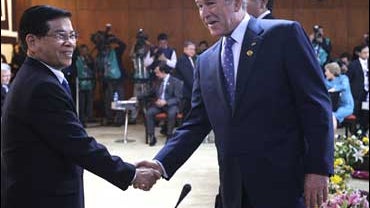 U.S. President George W. Bush shakes hands with Vietnam's President Nguyen Minh Triet 